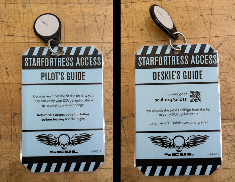 laminated card with a key and a lock that says 'access'